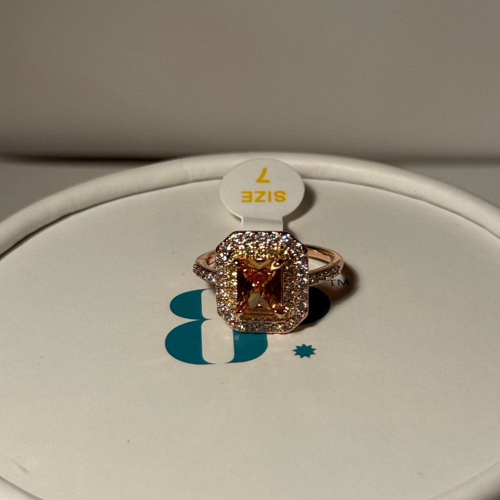 Radiant Gold Ring with Orange Gemstone